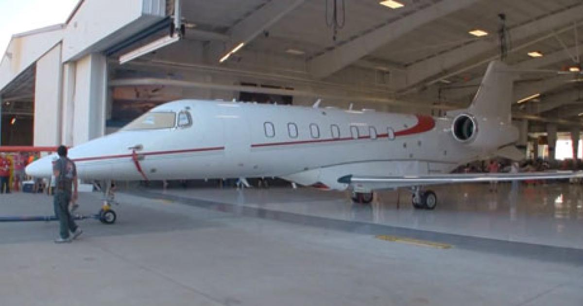 Seen here in a screen shot taken from a a YouTube video, Bombardier Aerospace apparently held a private rollout of its all-composite Learjet 85 on September 7 in Wichita. The aircraft appears mostly complete in the photo, and it has also been fitted with a drogue parachute that is required during flight testing. First flight of the midsize jet is expected by year-end.