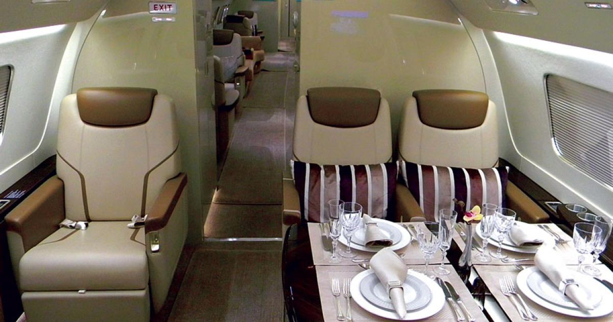 The enhanced interior of the Embraer Lineage 1000E ultra-large jet accommodates a well-appointed forward dining area.