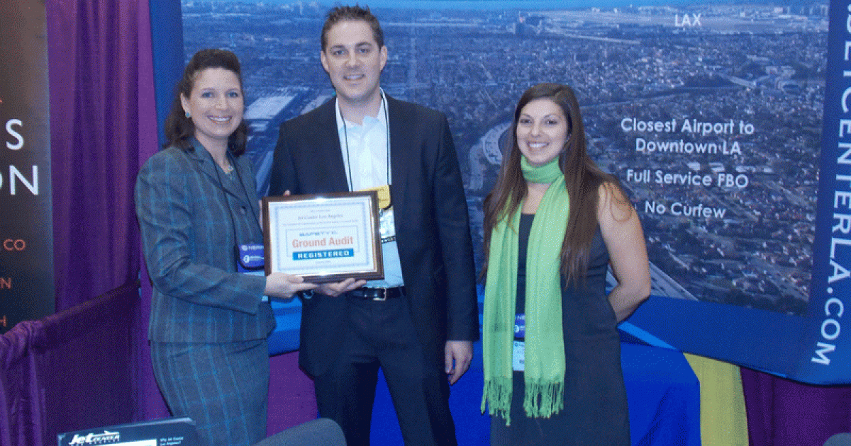 Left to right: Elizabeth Nicholson, NATA Safety 1st programs manager, presents its second successful ground audit registration to Los Angeles JetCenter president Levi Stockton and charter manager Jaclyn Folk at NBAA’s Schedulers and Dispatchers conference this week in New Orleans. (Photo: Curt Epstein)