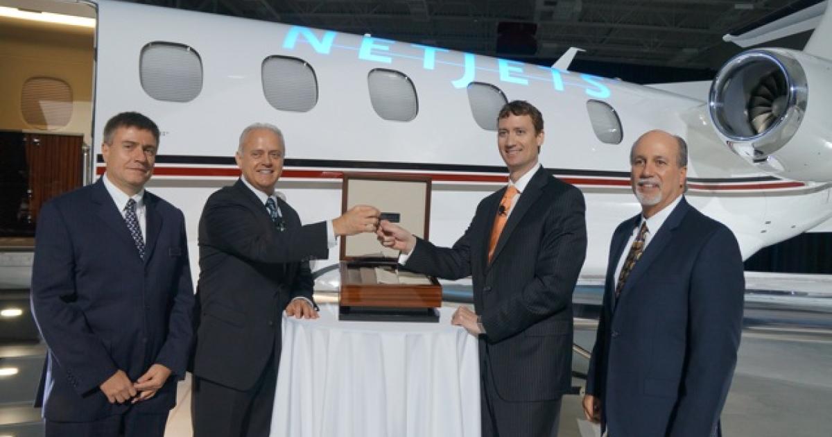 NetJets took delivery of its first "Signature Series" Phenom 300 on May 1 at the Embraer Executive Jets' customer center in Melbourne, Fla. Taking part in the handover ceremony were (l-r) Embraer Executive Jets senior vice president of operations and COO Marco Tulio Pellegrini, Embraer Executive Jets president Ernest Edwards, NetJets CEO Jordan Hansell and NetJets senior vice president of aircraft management Chuck Suma. (Photo: Chad Trautvetter)