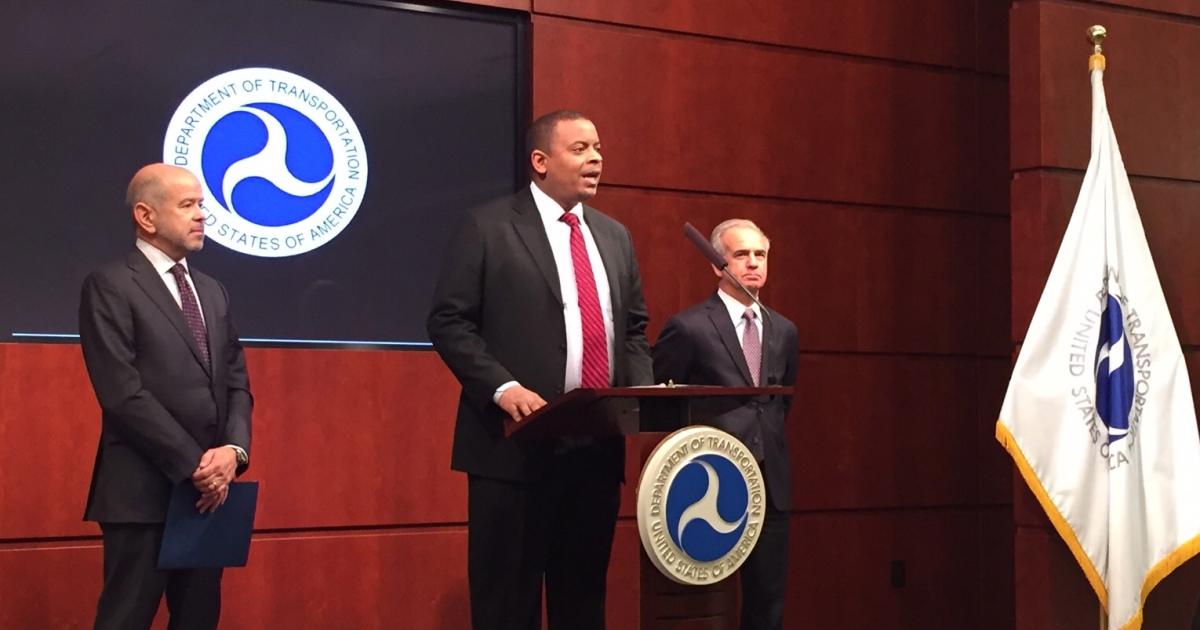 U.S. Transportation Secretary Anthony Foxx announces the release of the final SMS rule. To the left is FAA Administrator Michael Huerta; A4A president and CEO Nicholas Calio is at right. (Photo: FAA)