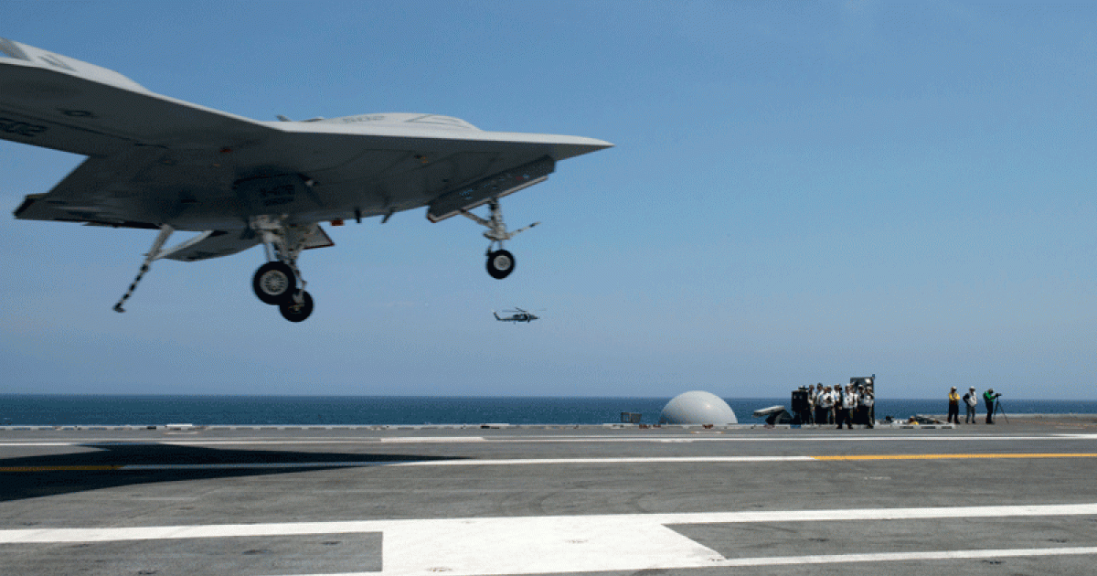 The X-47B unmanned combat air system demonstrator completes its first arrested landing on board the aircraft carrier George H.W. Bush on July 10. (Photo: U.S. Navy)